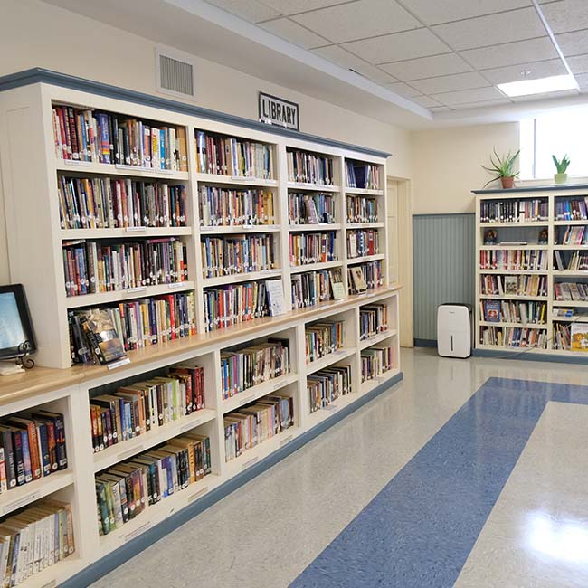 Wide shot of the Jericho Congregational Church library shelves
