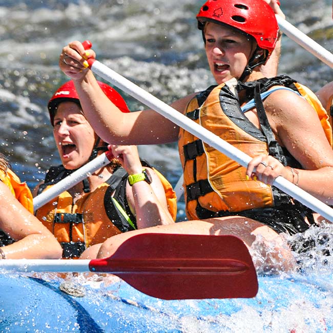 Youth group action shot during a retreat while rafting